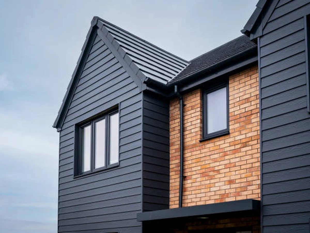 Exterior painting of a modern house with dark render by Darlington Decorators, Catterick Village