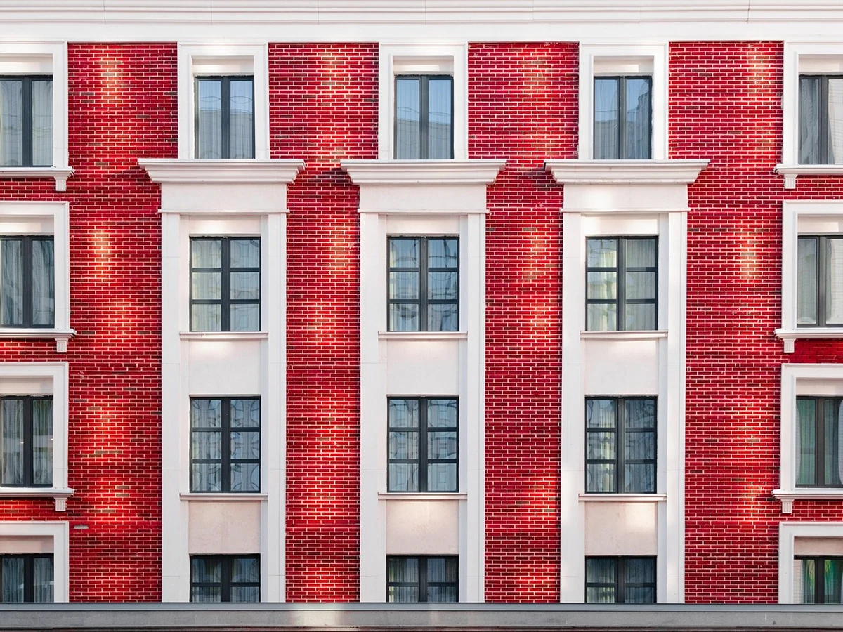 Exterior painting on red brick building in Darlington by Darlington Decorators