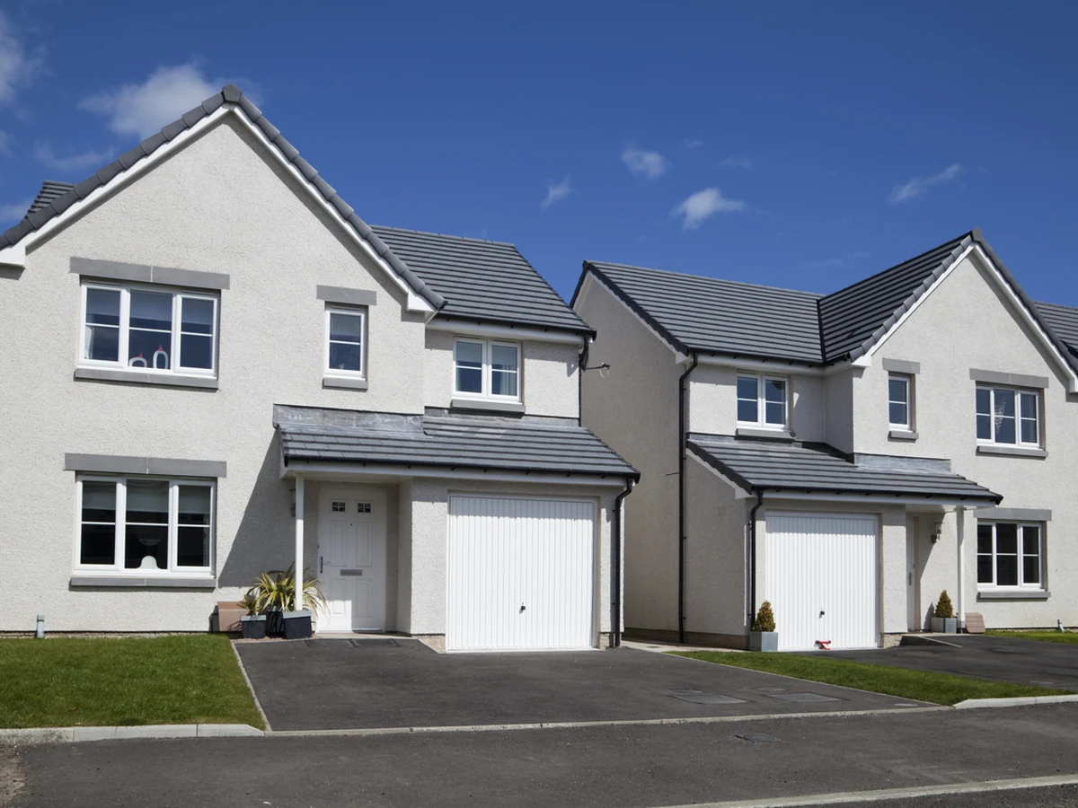 Two white rendered properties with fresh exterior masonry painting in Darlington