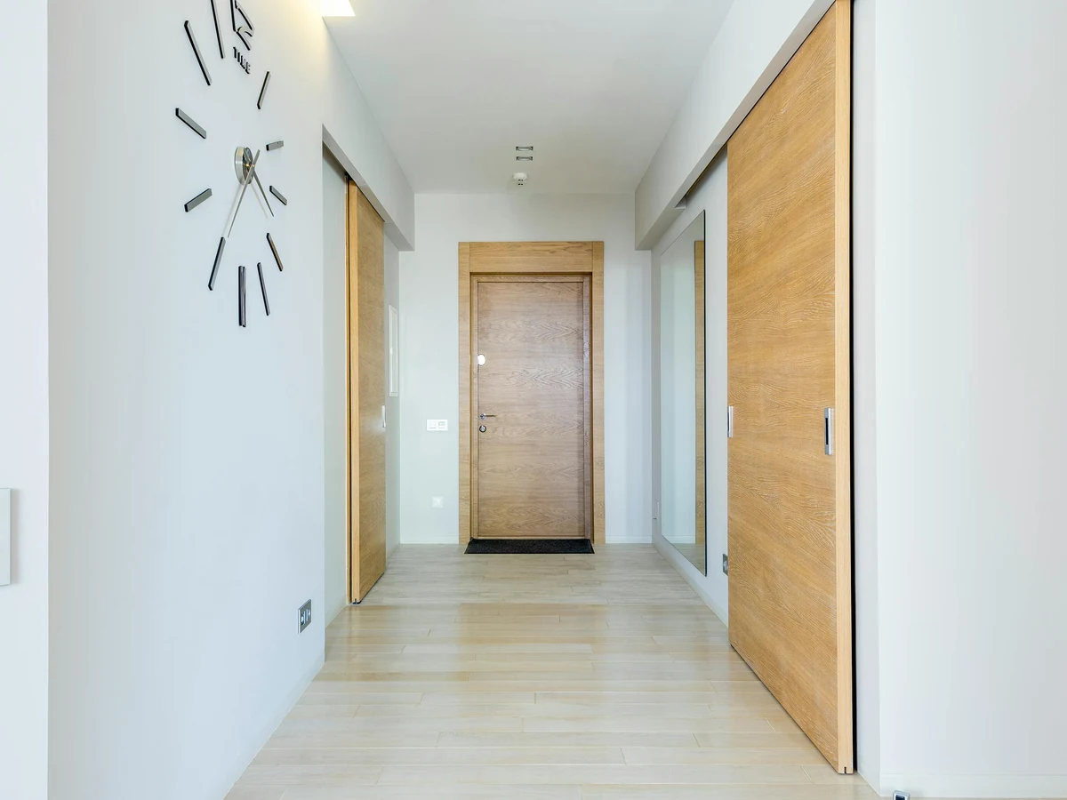 Hallway painting in a Romanby family home by Darlington Decorators, white walls with wood detail