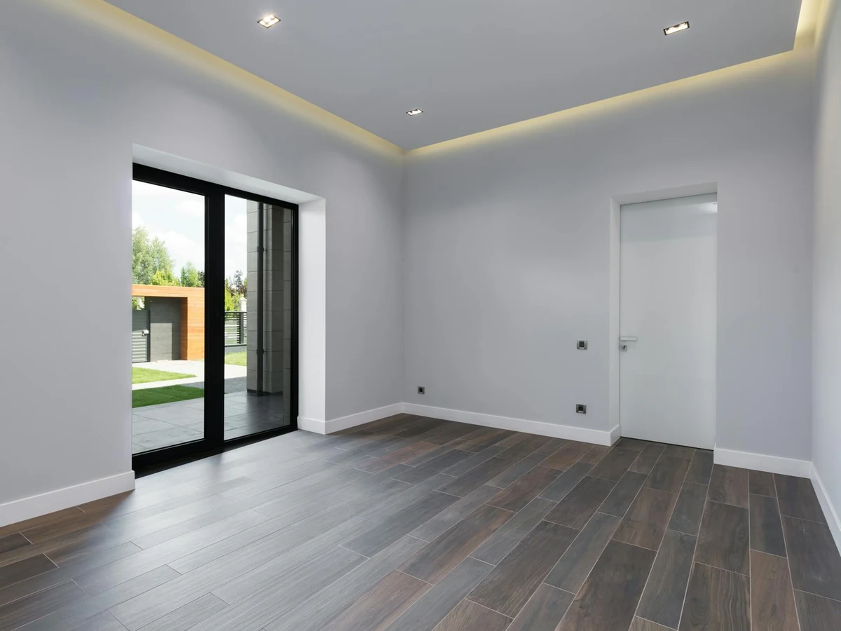 Interior painting of an empty grey room by Darlington Decorators in Catterick Village