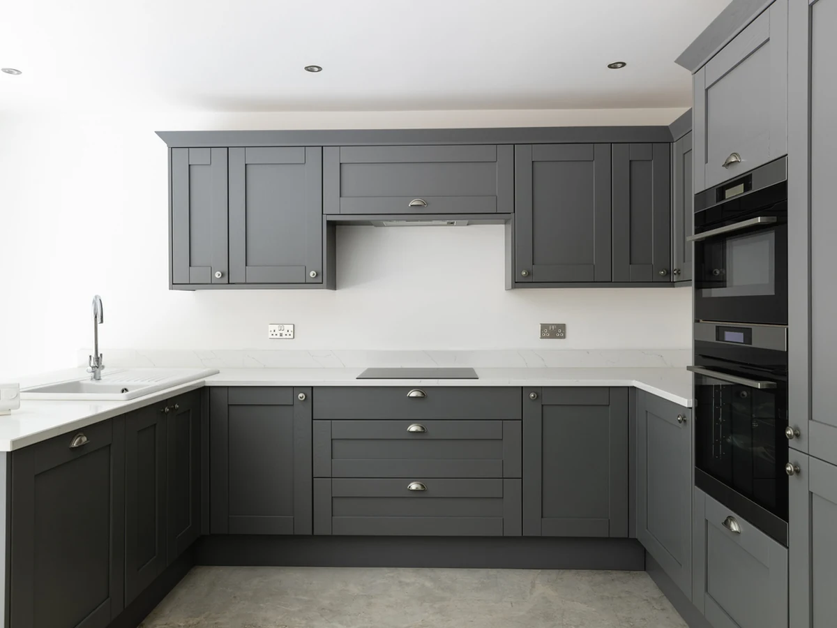 Sleek dark grey kitchen cabinet painting in Darlington by Darlington Decorators